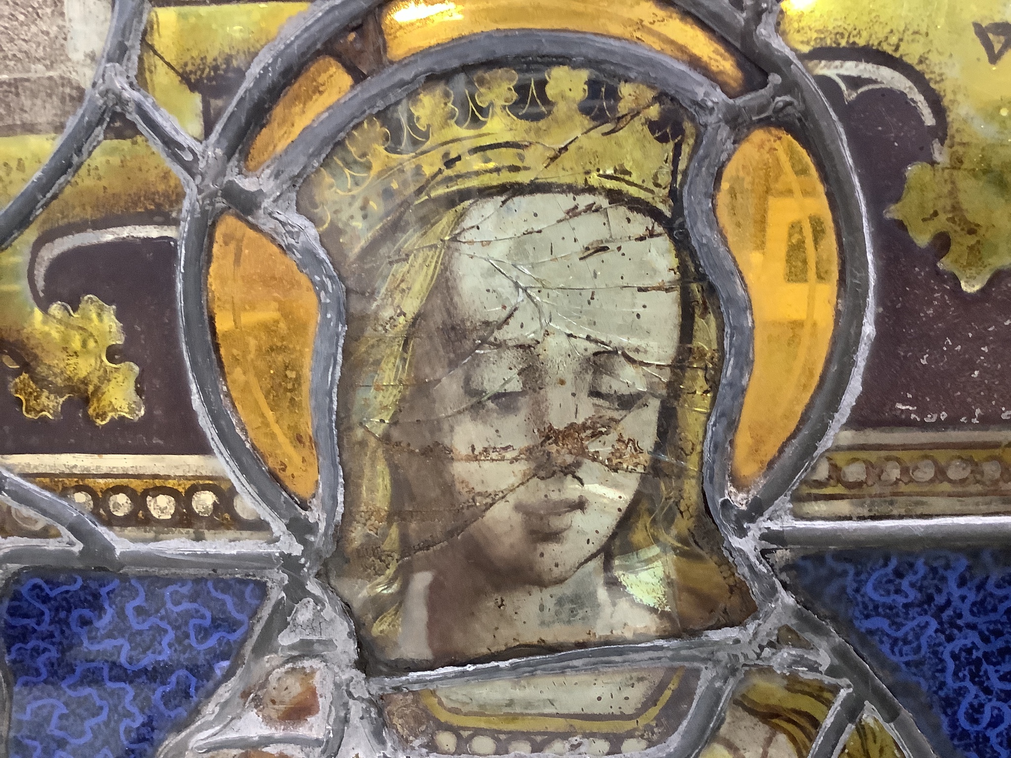 An early 16th century German stained leaded glass panel, depicting St. Catherine holding a sword and a book. 25 x 17.5ins. (later restorations and replacements)